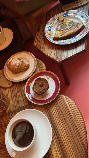 Coffee, custard croissant, Portuguese tart and a frittata    at Life's a Peach in Utrecht