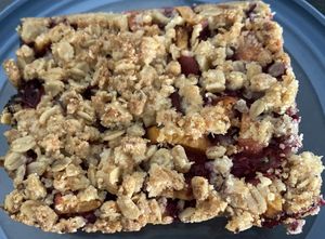 Crumble slice with homemade jelly: bland and salty (which is weird)  at Life's a Peach in Utrecht