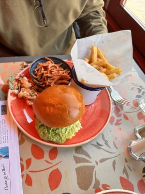 Beyond burger with “bacon” on the side with chips and salad  at Lounges - Clio Lounge in Bangor