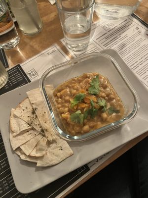 African peanut chickpea stew with coriander and dried apricot  at Vas Manci in Budapest