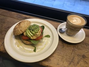 Vegan bagel and oatly latte  at La Masala Cafe in Barcelona
