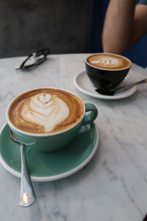 Soy and oat milk flat whites. Really good coffee here! at La Masala Cafe in Barcelona