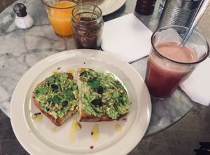 Avo on toast and pink smoothie at La Masala Cafe in Barcelona