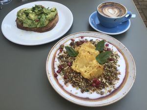 Avocado toast (without feta to make it vegan) and vegan coconut yogurt with grilled pineapple.  at NORTHSIDE espresso + kitchen in Kingston