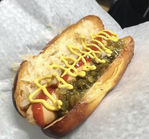 Vegan hot dog topped with Sauerkraut, Relish,  Mustard & Sriracha! at Harmless Hot Dog in Hollywood
