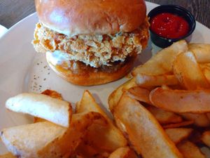 The Chicky Braxel with potato wedges at Plant Based Mafia in Palm Beach Gardens