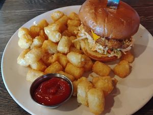 The Kosher Kowboy chick'n sandwich with tater tots at Plant Based Mafia in Palm Beach Gardens