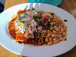 Combo #2 with vegan queso enchilada, jackfruit flauta, ancient grain blend, chickpea-white beans, cabbage salad, and guacamole. at Charro Vida in Tucson