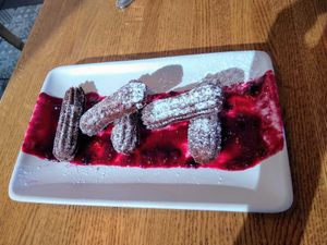 Gluten-free/vegan chocolate churros with elderberry sauce at Charro Vida in Tucson