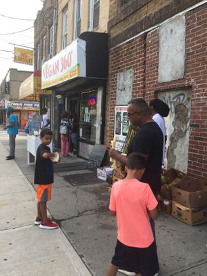 Kids enjoying fresh coconuts and sugar canes at DeeGee's Vegan 360° in Richmond Hill