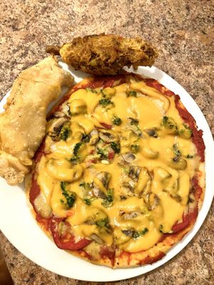 Vegan pizza, curry “chicken” drumstick, empanada  at DeeGee's Vegan 360° in Richmond Hill