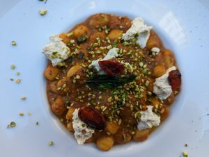 Gnocchi with tomato pesto, pistachios and vegan ricotta at Cavo Bistrot in Cagliari