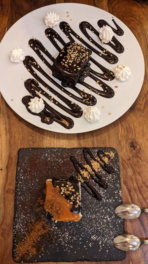 Chocolate Brownie and Cheesecake with Caramel- and Chocolatesauce at Cavo Bistrot in Cagliari