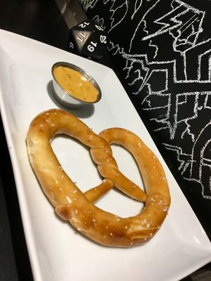 Zwicks pretzels brushed with vegan butter, served with vegan nacho cheese sauce at Table Top Cafe in Edmonton