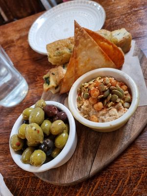 Marinated olives + hummus & bread at Cosmic Kitchen in Plymouth