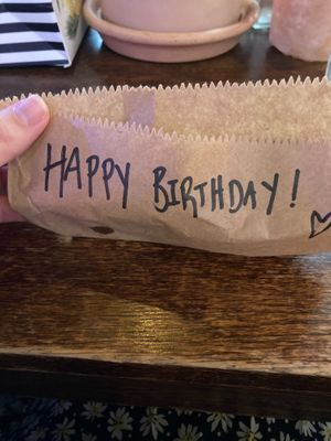 Lovely staff wrote happy birthday on my brownie 🥰 at Cosmic Kitchen in Plymouth