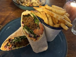 Shawarma wrap with paprika fries   at Cosmic Kitchen in Plymouth