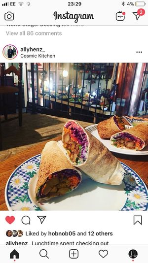 Jackfruit Gyros - Pulled marinated jackfruit, beet hummus, pickled red cabbage, salad, coriander, garlic mayo & chilli sauce in Mediterranean flatbread!  at Cosmic Kitchen in Plymouth