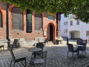 Outside eating area in the square at Cosmic Kitchen in Plymouth