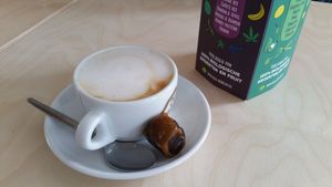 Cappuccino with oat milk and a fresh date. at Klein Geluk Ontbijt in Heemskerk