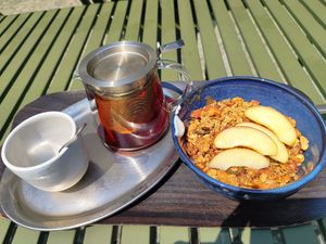 Large Bircher Müesli with Soy Yoghurt and Granola and Assam Tea (on the terrace 🤩) at Farel Bistro in Biel