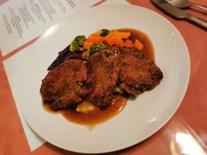 Homemade haggis style fritters with mash, veg and gravy. at Ginger Vegetarian Cafe in Halifax