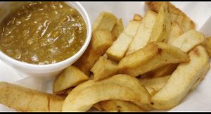 Chips and curry sauce  at JJ's Vish & Chips in Leeds
