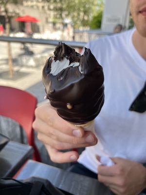 Vegan vanilla soft serve dipped in the dark chocolate (only vegan dip option)  at Chocolats Favoris in Montreal