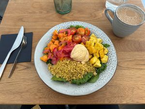 Lunch bowl: quinoa, sweet potatoes, tofu, hummus and salad  at Roots Helsinki in Helsinki