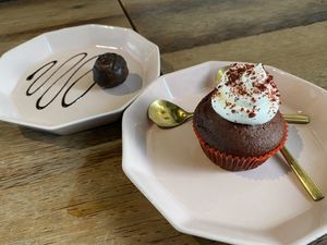 Red velvet cupcake and chocolate-banana-cashew truffle  at Vistro in Bangkok