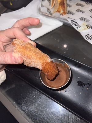 Vegan churro with vegan chocolate saucee  at Dilla Libre in Scottsdale