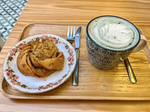 Cardamom roll and spirulina latte  at Terrae Organica in Vigo