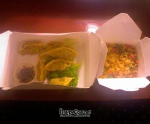 Smiling dumplings and golden rice at Loving Hut in Orlando