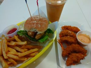 Ocean filet burger, Thai iced tea, and curled island appetizer (which is vegan shrimp). at Loving Hut in Orlando