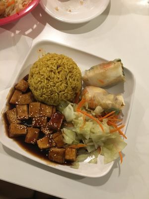 Combo #1 mushroom tofu, yellow rice, and summer rolls. at Loving Hut in Orlando
