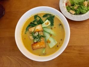 Spicy curry ramen with side salad. at The Vegan Ramen in Da Nang
