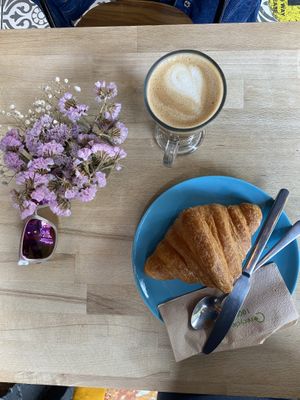 Oat latte and croissant at Parlé Pantry in West London