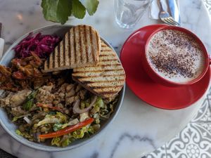 Salad plate and oatmilk cappuccino at Parlé Pantry in West London