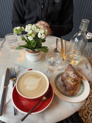 Latte and almond croissant  at Parlé Pantry in West London