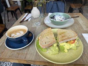 Egg sandwich, more like egg salad with latte and a special yogurt and fruit plate they made me  at Parlé Pantry in West London
