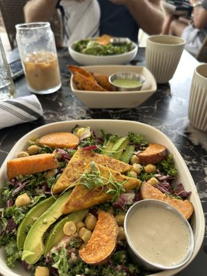 Seasonal Chickpea Buddha Bowl with a side of potato wedges   at New General in Winter Park