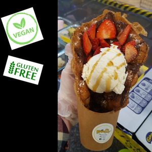 Vegan and Gluten Free Bubble Waffles served with anything you wish, this time with Vego Chocolate Spread, Strawberries, Vanilla Vegan Ice Cream and Butterscotch Sauce. at Kawaffle in Plymouth