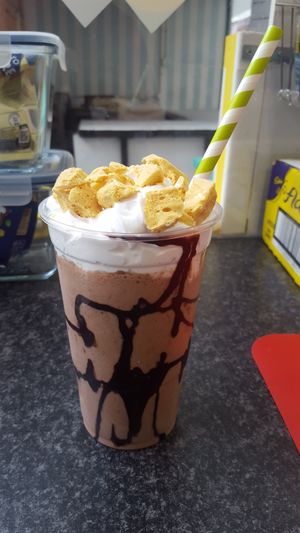Vegan Milkshake using Chocolate Nut Spread, chocolate ice cream, cream, chocolate sauce and toffee honeycomb. at Kawaffle in Plymouth