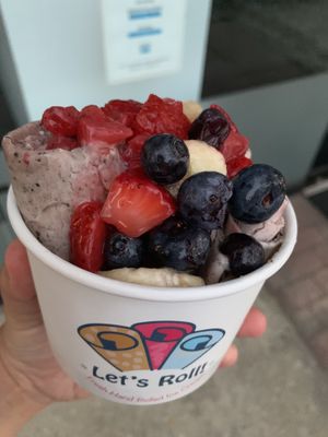 Topped with fresh fruit  at Let's Roll in Merrick