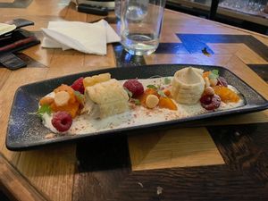 Earl Grey cheesecake w/ macadamia cream, raspberry and roast peach at Ballard's in Thornbury