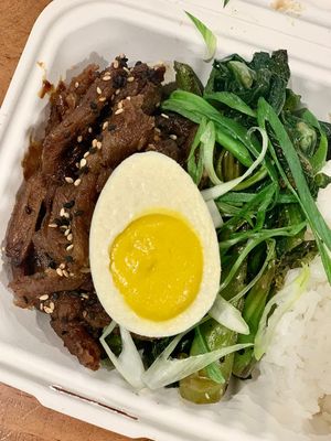 Cha Shao Bowl special - Cantonese style bbq soy curls, Chinese broccoli and vegan poached ‘egg', served with white rice at Foodhisattva in Cleveland Heights