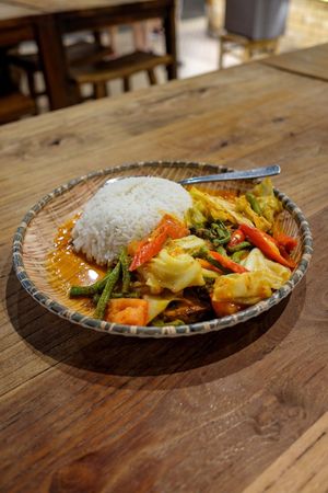 Indonesian veg fish rice sambal pepes with fish pieces made with tofu skin and a sour spicy sauce.
 at Double Durian - VivoCity  in Central Singapore