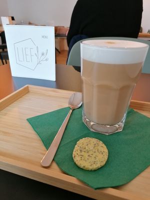 Latte with oatmilk. The cookie is not vegan! at LIEF in Mechelen