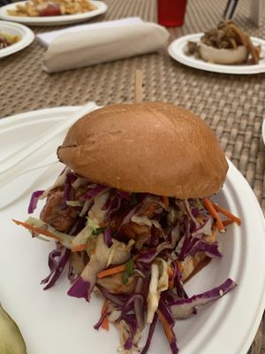 Korean style chicken sandwich with cashew cheesecake in the back  at Modern Times Beer in Santa Barbara