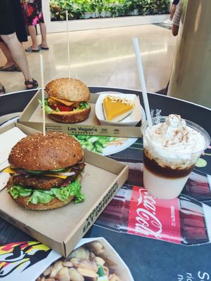 Great burgers, latte with cream and a raw cake. All vegan and delicious! at Las Vegan's - Corvin Plaza in Budapest